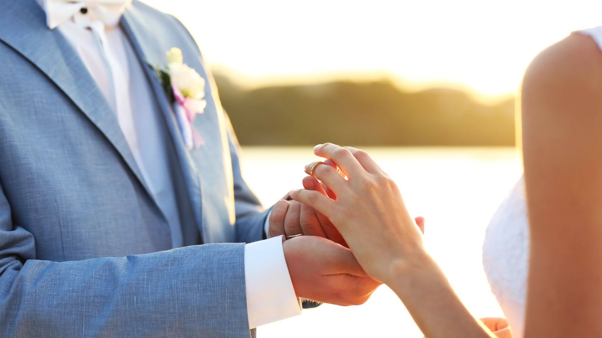 Couple exchanging rings at their wedding