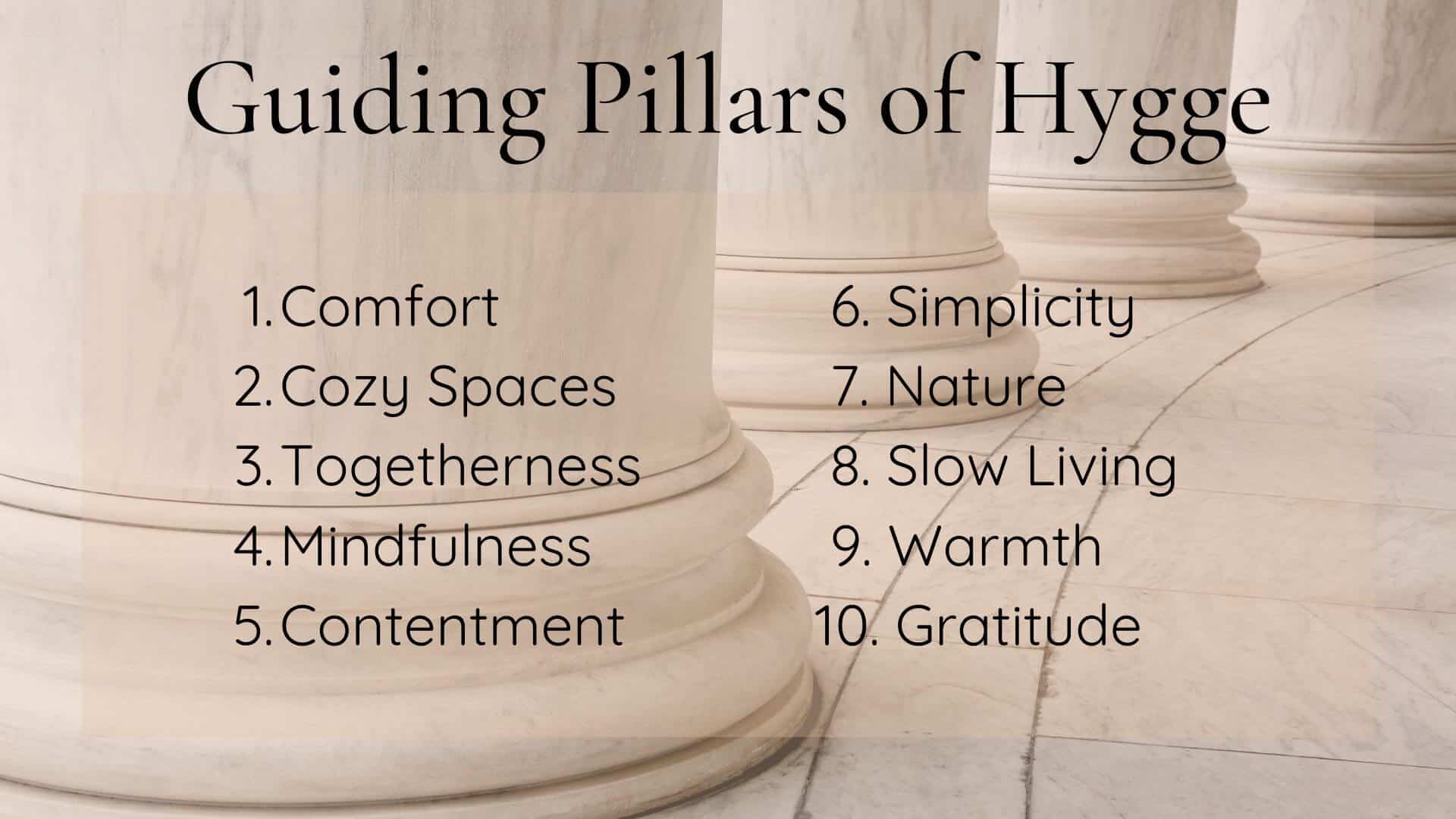 closeup of base of white marble pillars with text of guiding pillars of hygge