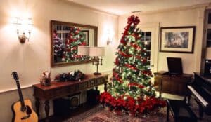 living room at devonfield inn decorated for christmas with evergreen and twinkling lights